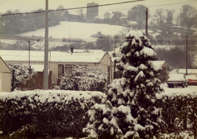 A prefab (Arcon Mk V) covered with snow, and tree, Newport, Wales | Blanchet,Elisabeth