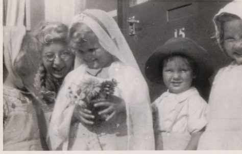 Kathryn, her brother Neal and three children in fancy dress outside the prefab, St Pauls Cray