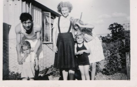 Kathryn, her brother Neal and mum and dad outside their prefab, St Pauls Cray