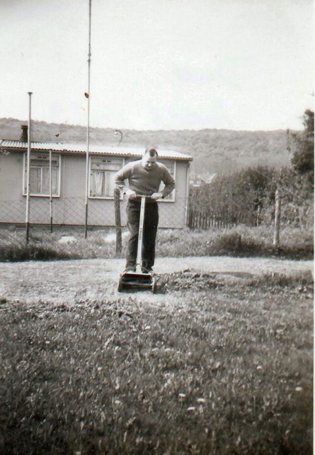 Mowing the grass in the prefab garden | Hearn, Jane