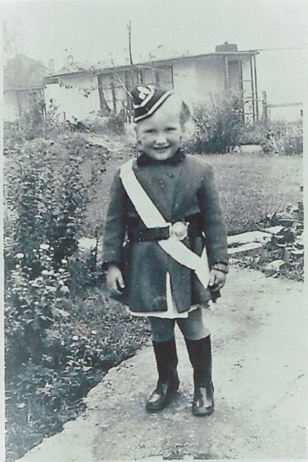 Small child in costume in prefab garden | Hearn, Jane