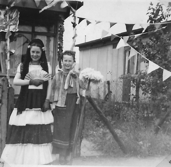 Two children in fancy dress, 'Mrs Mop'.  Stewart Street, London E14