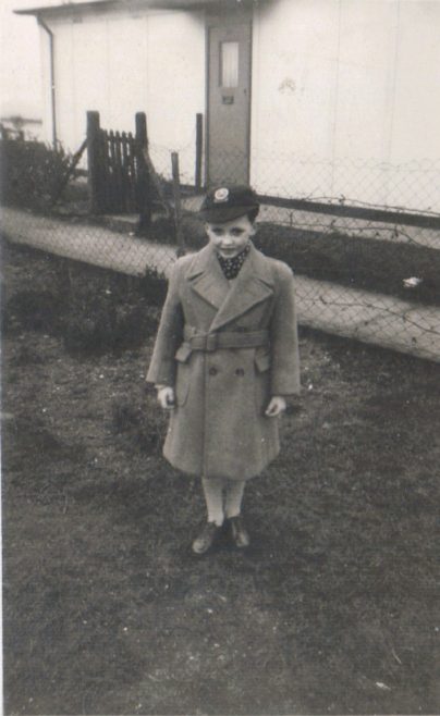 April 1956. Terence in his first Crombie overcoat in front of the prefab, Dartmouth Park Hill, London NW5