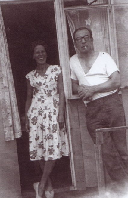 Jim's mum and dad in the doorway of their prefab. Excalibur Estate, London SE6