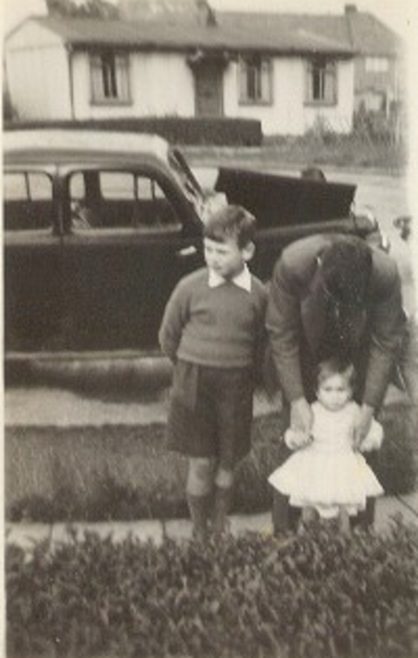 Melanie and family outside the prefab. Lowden Croft, South Yardley, Birmingham